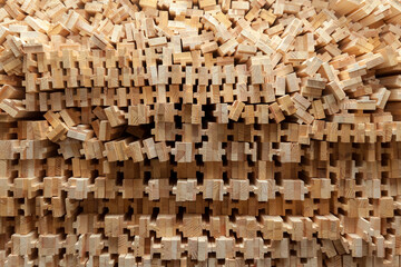 wooden slats stacked on a pile