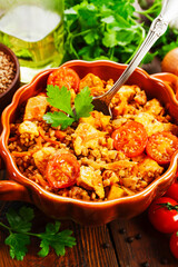 Buckwheat with meat and tomato