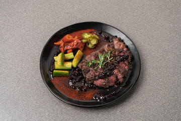 Sliced medium rare grilled Steak Ribeye with rosemary