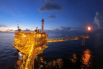 Offshore oil and gas or rig platform with beautiful sky in the evening time for oil and gas...