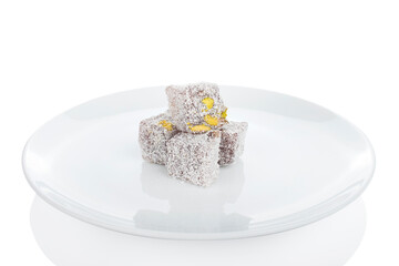 Turkish delight, pistachio delight in white plate on background
