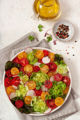 Healthy vegetable salad of fresh tomato, lettuce and radish .Healthy eating