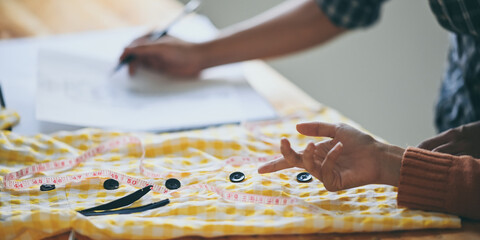 Obraz premium Costume design team is working together in the dressing room.