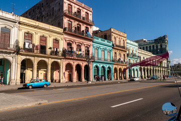 Fototapeta na wymiar Havana, Cuba in February 2018. Traditional and colorful old cars with old buildings in the background.