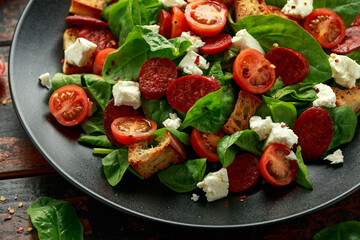 Chorizo Tomato salad with spinach, feta cheese and croutons. healthy summer food