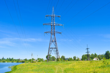 High-voltage power line outside the city near the river