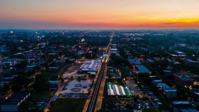 night aerial drone hyper lapse of the city fireworks during 4th of July in Chicago west side neighborhood.  Independence day is a festive day that Americans celebration city wide 