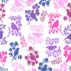 Seamless pattern with pink and purple bird silhouettes in flowers