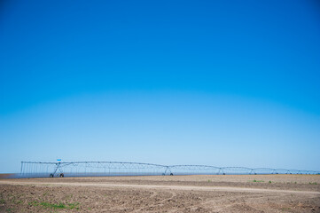 Modern agricultural irrigation system spraying in field