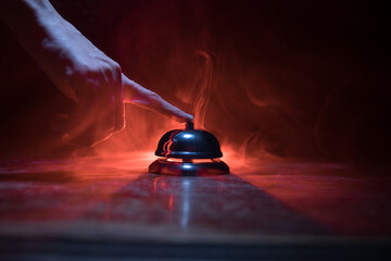 Hotel reception bell, service bell on the table, selective focus - obrazy, fototapety, plakaty