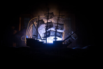 Black silhouette of the pirate ship in night