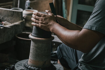 Artisan potter making art pot handicraft