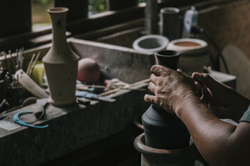 Artisan potter making art pot handicraft