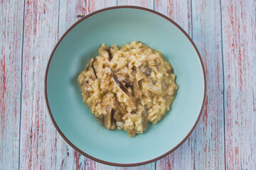 risotto with mushrooms and truffle on a warmly coloured plate