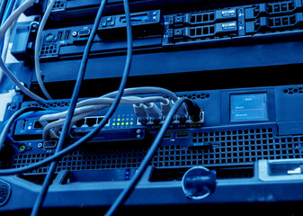 Server room with computers for internet. Network cables connected to switches.