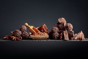 Chocolate truffles with broken pieces of chocolate and spices.