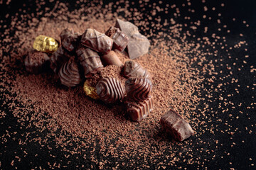 Chocolate candies sprinkled with chocolate chips.