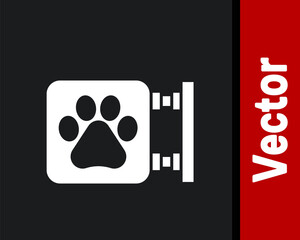 White Veterinary clinic symbol icon isolated on black background. Cross hospital sign. A stylized paw print dog or cat. Pet First Aid sign. Vector.