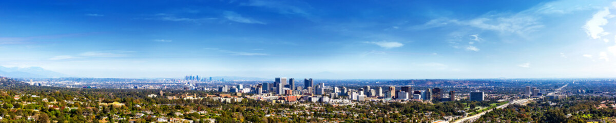 Fototapeta na wymiar Panorama view of Los Angeles icity skyline in a sunny day. Los Angeles, California, USA.