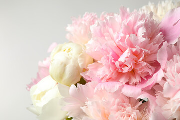 Beautiful peony bouquet on light background, closeup