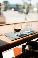 Obraz na płótnie Canvas Espresso in Glass on Counter in The Sun