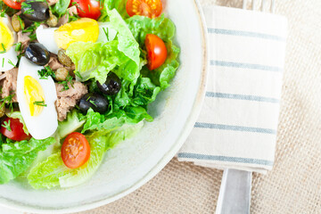 Chef's salad with tuna fish, black olives and egg in caper-mayonaisse sauce.