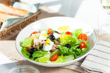 Chef's salad with tuna fish, black olives and egg in caper-mayonaisse sauce.