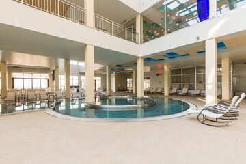 Fototapeta premium Indoor swimming pool in hotel spa and wellness center