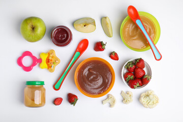 Flat lay composition with baby food and ingredients on white background
