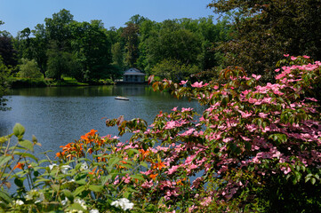 Fototapeta na wymiar Griffins Pond with flowers and Titanic model at the Historic Halifax Public Gardens