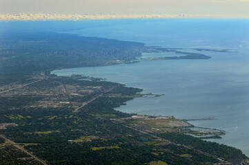 Obraz premium Aerial view of Lake Ontario coastline with Mississauga and Toronto Harbourfront