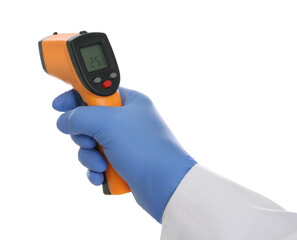 Doctor in latex gloves holding non contact infrared thermometer on white background, closeup. Measuring temperature