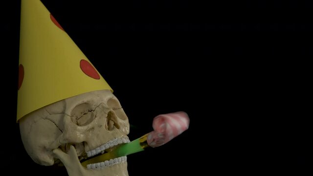 Devil birthday. Skull with cap and party whistle.