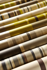 Variety of multicolored wallpaper rolls