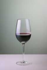 Glass of red wine with neutral background