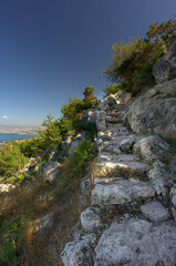 Hiking natural rock stairways for a beautiful sea viewpoint in Cyprus