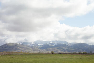 Obraz premium Beautiful mountain landscape. Wildlife Kyrgyzstan. Clouds in the sky. Kyrgyzstan