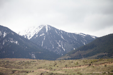 Beautiful mountain landscape. Wildlife Kyrgyzstan. Clouds in the sky. Kyrgyzstan