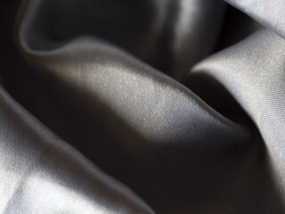 Obraz premium Smooth elegant grey silver silk or satin texture can use as background. silver fabric texture close up