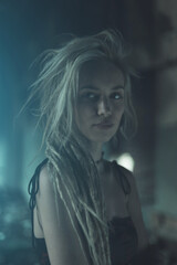 Beautiful young woman posing in ruined place