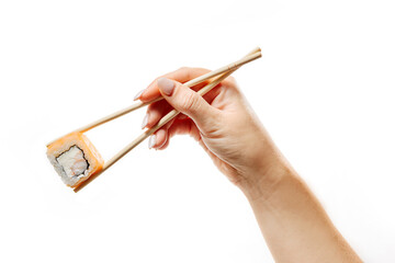 A female hand holds a roll of chopsticks.