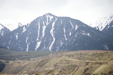 Beautiful mountain landscape. Wildlife Kyrgyzstan. Clouds in the sky. Kyrgyzstan