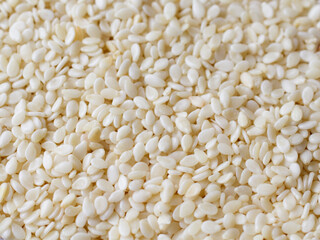 background of roasted sesame seeds close up
