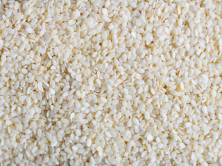 background of roasted sesame seeds close up
