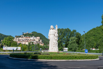rotunda with monument of saint rita and behind in the background cascia