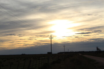 Obraz premium wind turbine at sunset