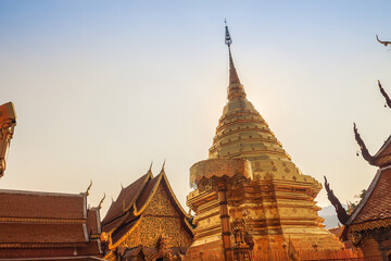 Fototapeta premium Beautiful northern Thai style architectural of golden pagoda with golden umbrella at Wat Phra That Doi Suthep, the famous temple and became the landmark of Chiang Mai, Thailand.
