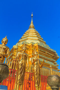 Beautiful northern Thai style architectural of golden pagoda and golden Buddha Image at Wat Phra That Doi Suthep, the famous temple and became the landmark of Chiang Mai, Thailand.