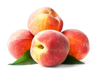Bunch of ripe peaches with green leaves on a white background. Isolated