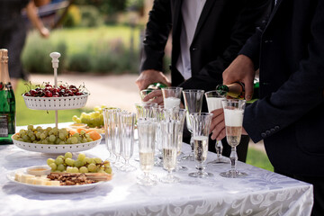waiter serving champagne at restaurant